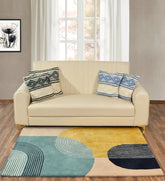 Hand-tufted wool rug with colorful arched geometric lines in teal, mustard, black, and beige in living room.